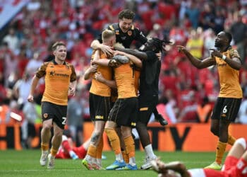 Hull City players celebrating promotion to the Premier League at Wembley Stadium