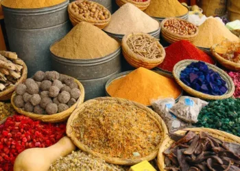 Nigerian market traders selling food items amid rising inflation and increasing prices