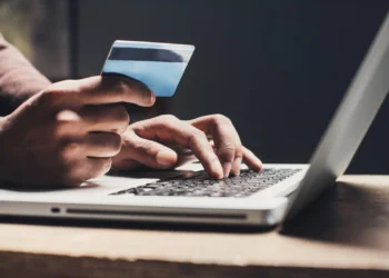 Nigerian investor checking online investment opportunities and avoiding financial scams