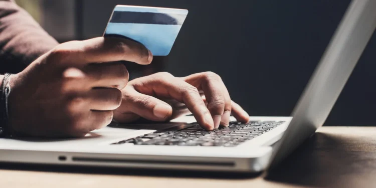 Nigerian investor checking online investment opportunities and avoiding financial scams