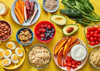 Healthy Nigerian meal plan with vegetables, grilled fish, beans, fruits, and brown rice for weight loss and fitness