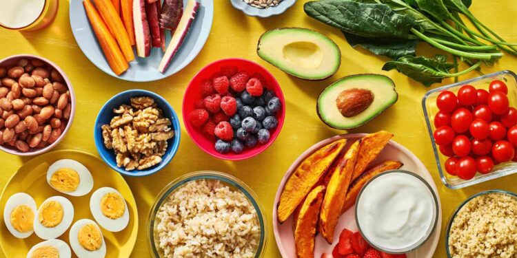 Healthy Nigerian meal plan with vegetables, grilled fish, beans, fruits, and brown rice for weight loss and fitness