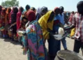 Market traders and shoppers in Nigeria amid rising poverty and cost of living.