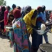Market traders and shoppers in Nigeria amid rising poverty and cost of living.