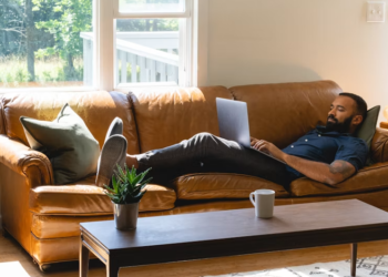 Professional staying productive while working from home in a modern home office.