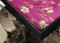 Illustrative image of a damaged bedroom floor highlighting rental property safety concerns.