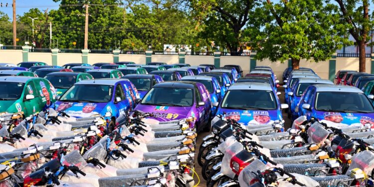 Musa Yaro Enabo presenting campaign vehicles and motorcycles to Governor Nasir Idris